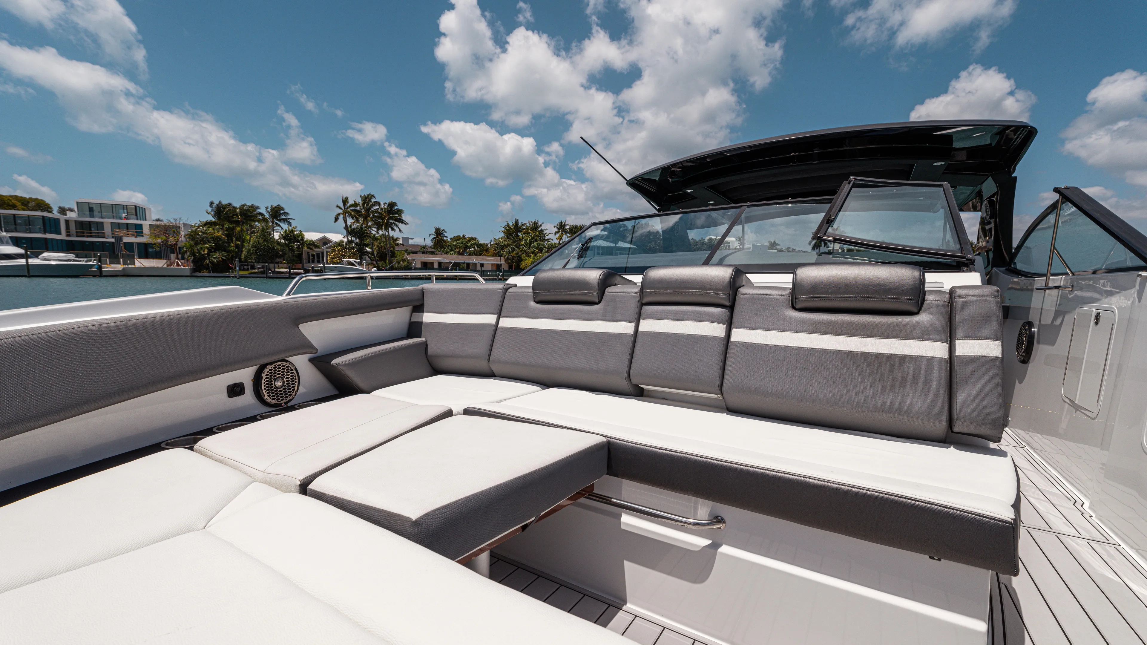  Yacht Photos Pics 2020 Cruisers Yachts 38 GLS OB with luxurious seating under a sunny sky.