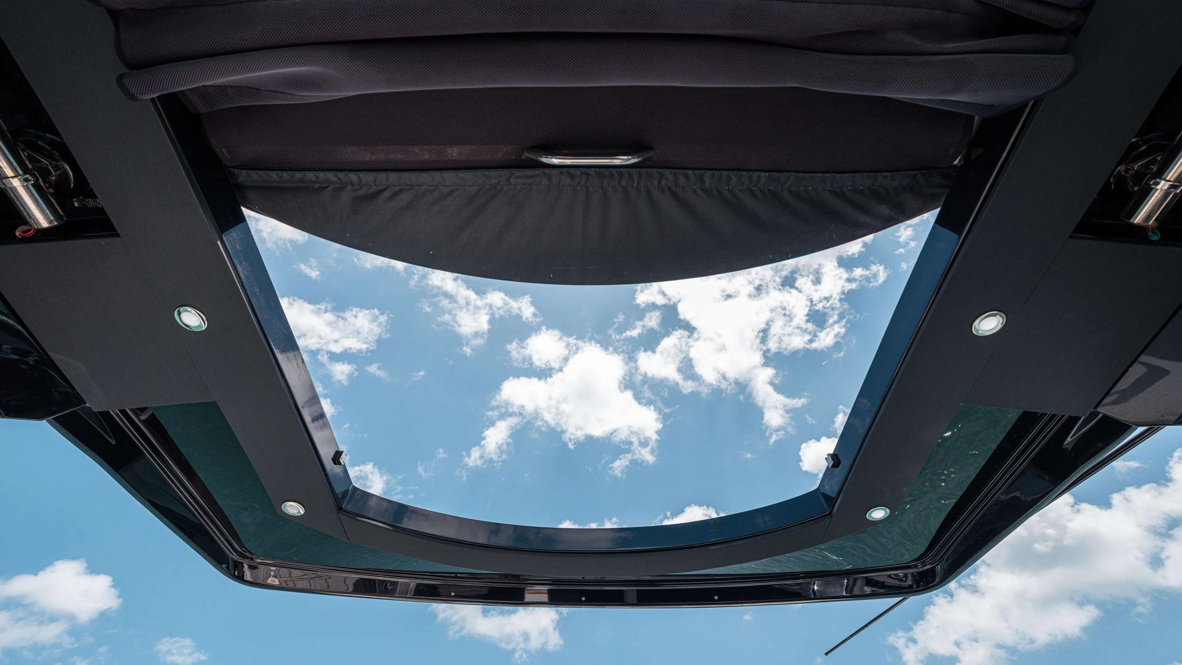  Yacht Photos Pics Sky view through the sunroof of a 2020 Cruisers Yachts 38 GLS OB.