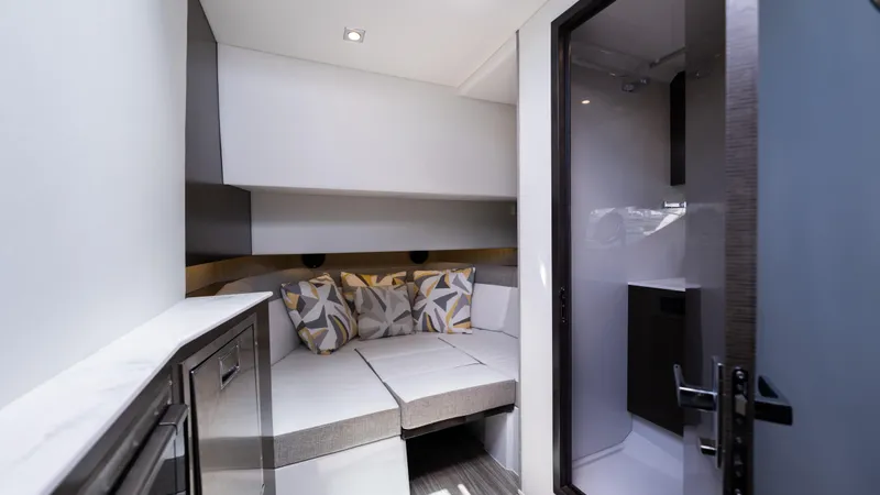  Yacht Photos Pics Interior cabin of 2020 Cruisers Yachts 38 GLS OB, featuring cozy seating and modern design.