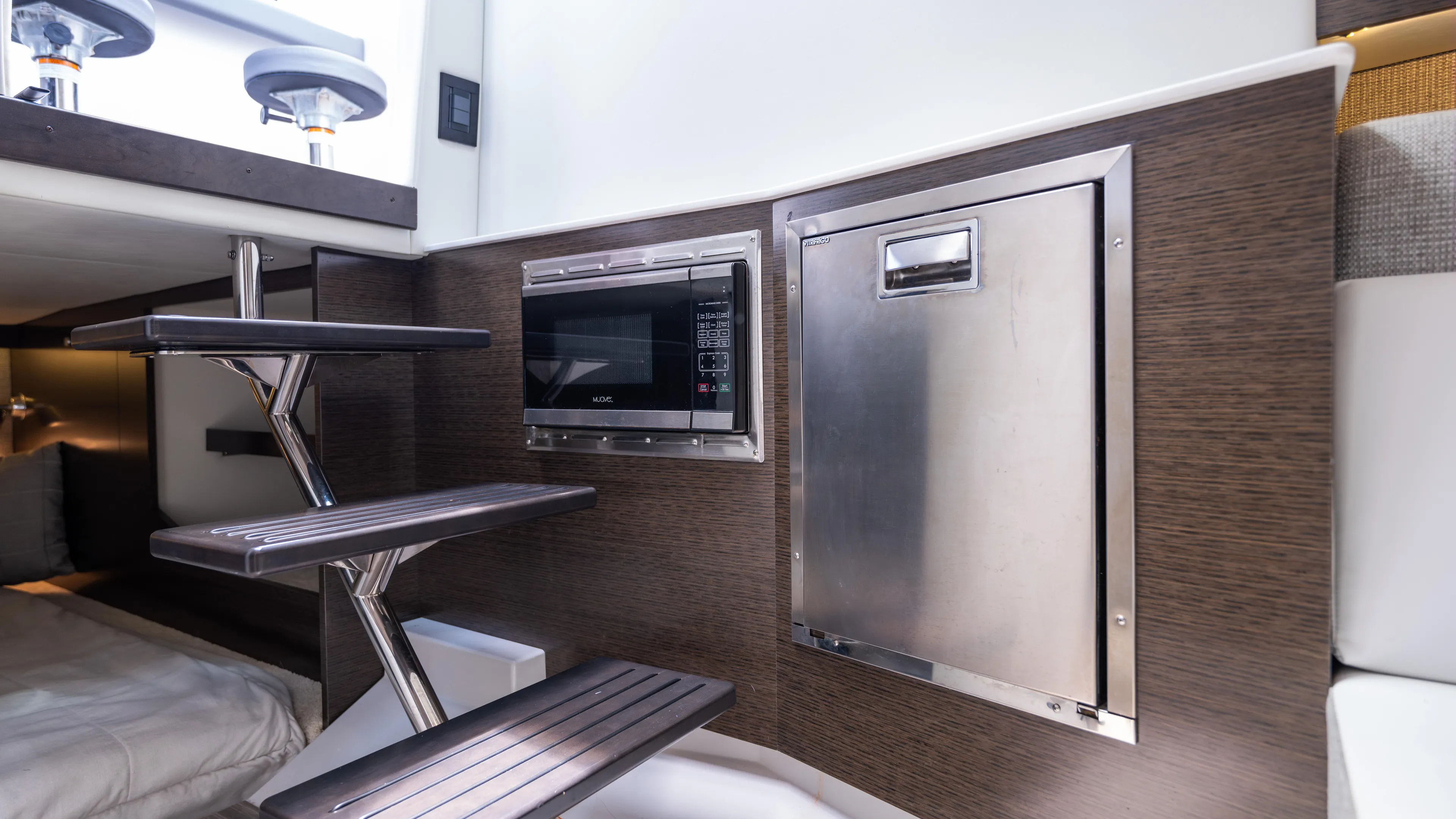  Yacht Photos Pics Interior of 2020 Cruisers Yachts 38 GLS OB with modern kitchenette and sleek design.