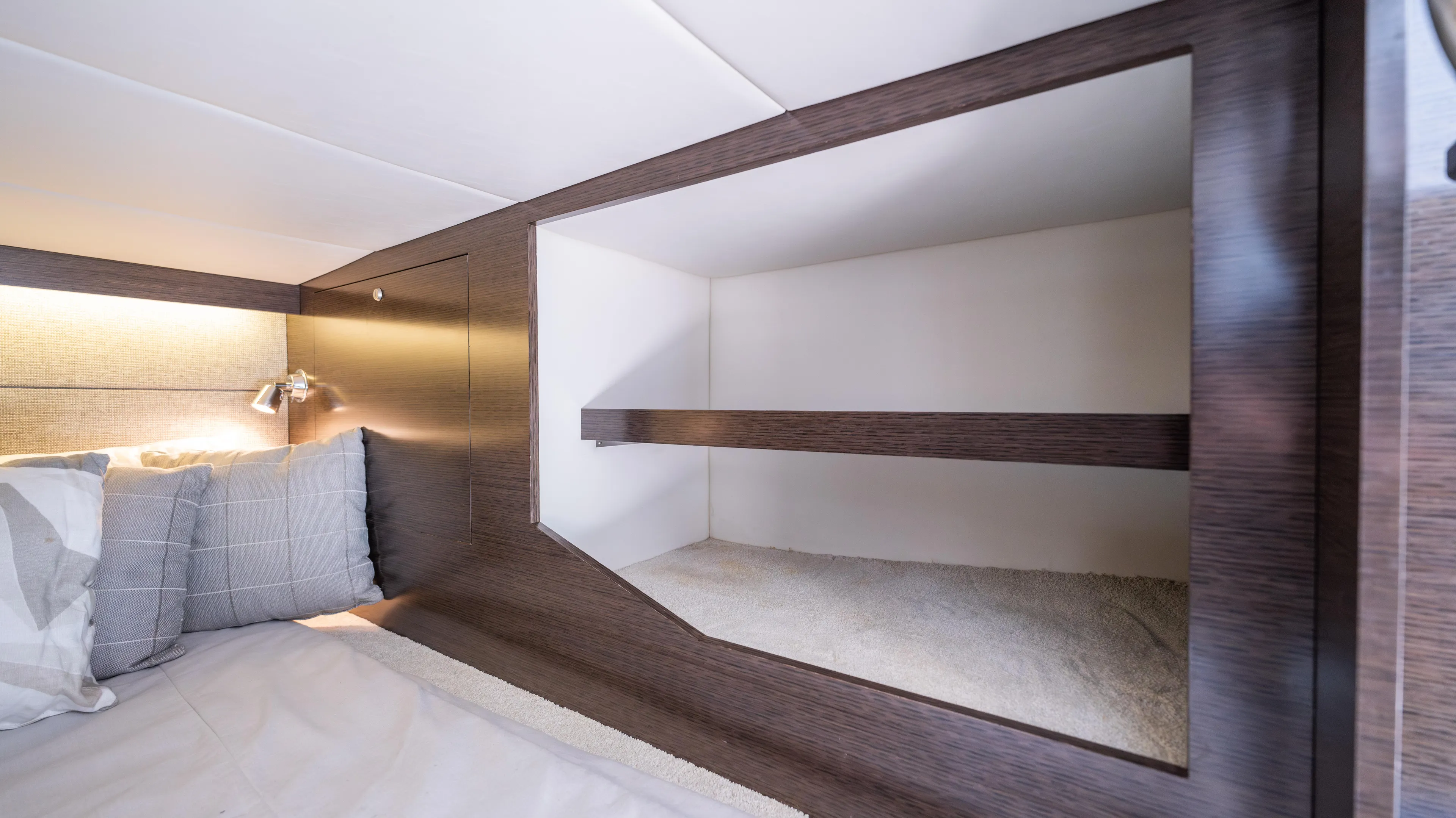 Yacht Photos Pics 2020 Cruisers Yachts 38 GLS OB cabin interior with modern shelving and cozy bedding.