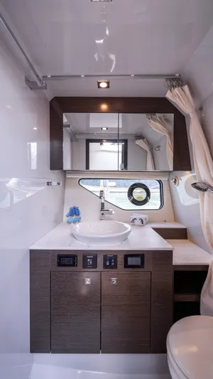  Yacht Photos Pics Modern bathroom interior of 2020 Cruisers Yachts 38 GLS OB, featuring sleek design and fixtures.