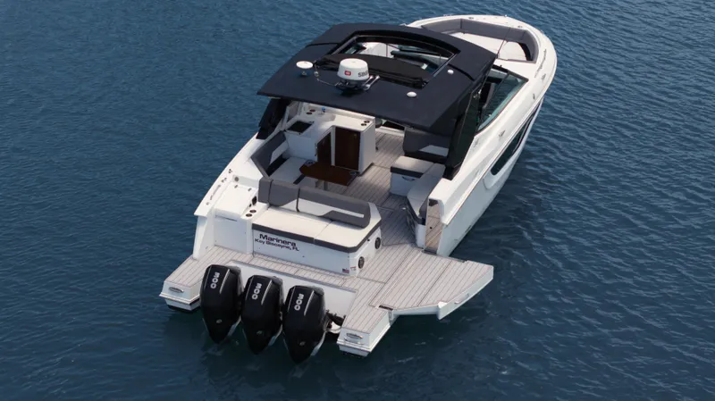 Yacht Photos Pics 2020 Cruisers Yachts 38 GLS OB on water, featuring triple outboard engines.