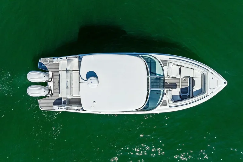  Yacht Photos Pics Overhead view of 2022 Regal 33 OBX boat on green water.