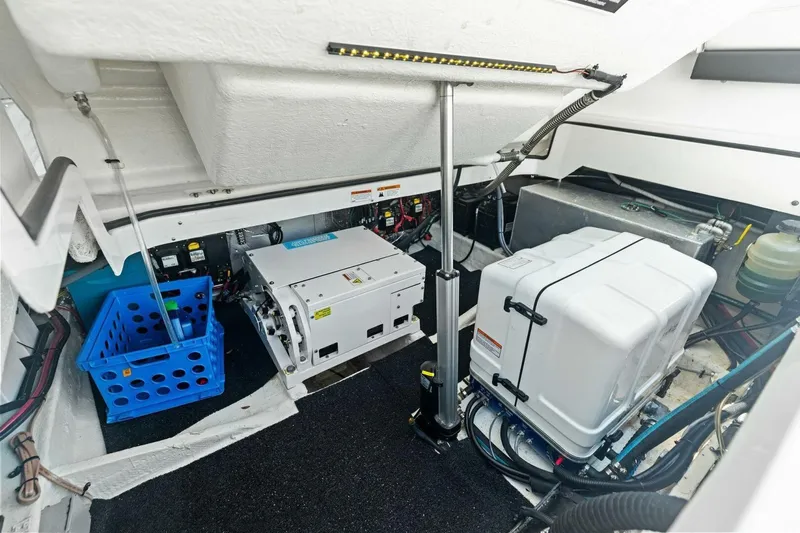  Yacht Photos Pics Engine compartment of 2022 Regal 33 OBX boat, featuring equipment and storage.