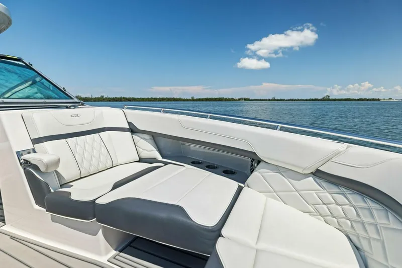  Yacht Photos Pics Luxurious seating on 2022 Regal 33 OBX boat with scenic water view.