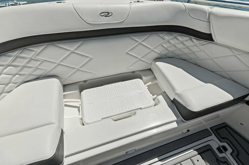  Yacht Photos Pics 2022 Regal 33 OBX boat interior with diamond-stitched seating and integrated cooler.