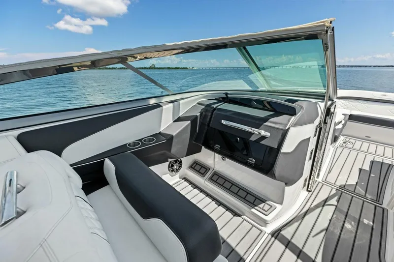  Yacht Photos Pics 2022 Regal 33 OBX boat interior with sleek seating and open water view.