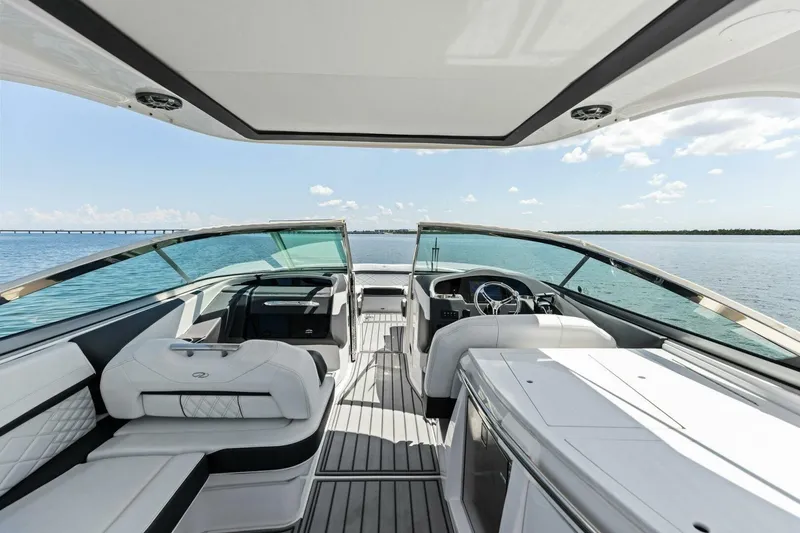  Yacht Photos Pics 2022 Regal 33 OBX boat interior with luxurious seating and ocean view.