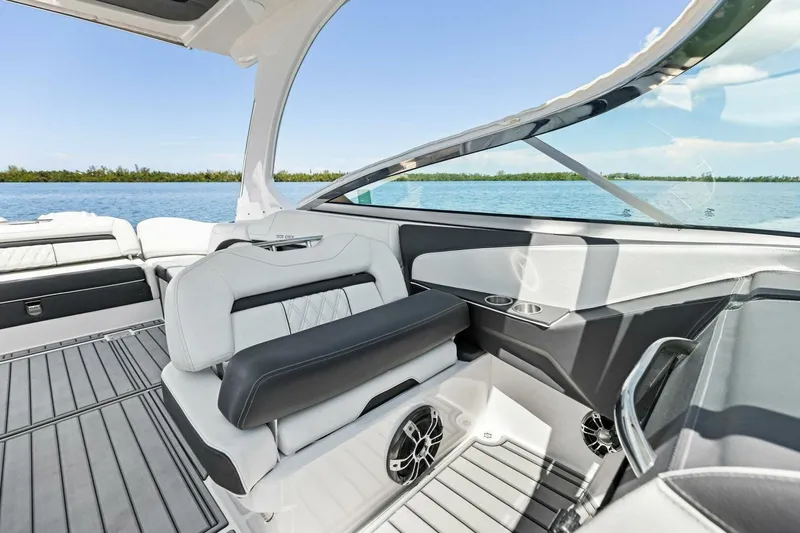  Yacht Photos Pics 2022 Regal 33 OBX boat interior with luxurious seating and scenic water view.