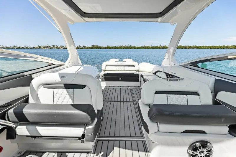  Yacht Photos Pics 2022 Regal 33 OBX boat interior with luxurious seating and scenic water view.