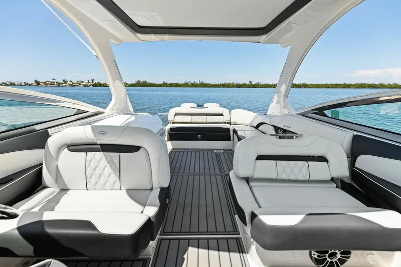  Yacht Photos Pics 2022 Regal 33 OBX boat interior with luxurious seating and scenic water view.