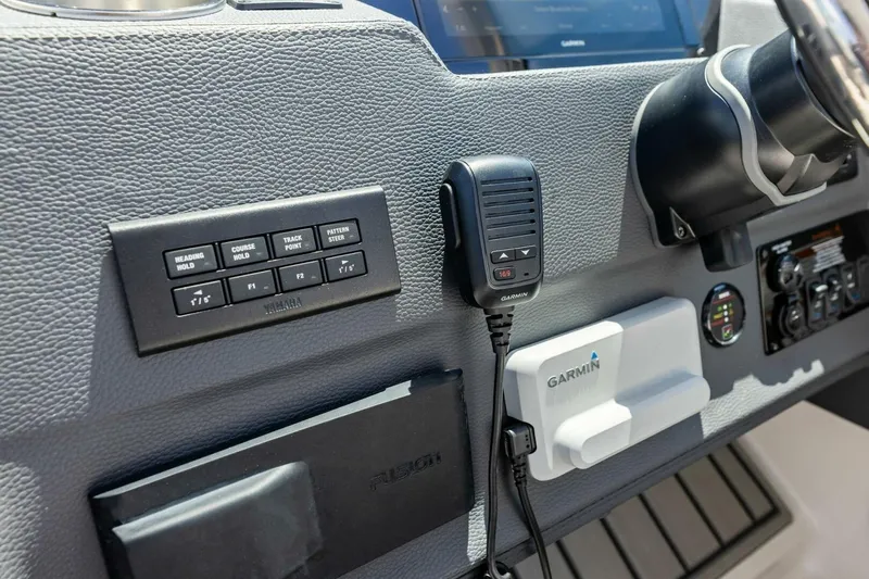  Yacht Photos Pics 2022 Regal 33 OBX dashboard featuring Garmin marine electronics and Yamaha controls.