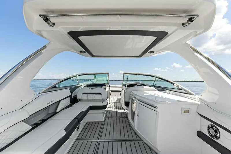  Yacht Photos Pics Luxurious interior of 2022 Regal 33 OBX boat with sleek seating and modern design.