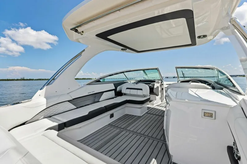  Yacht Photos Pics Luxurious 2022 Regal 33 OBX boat interior with spacious seating and sleek design.