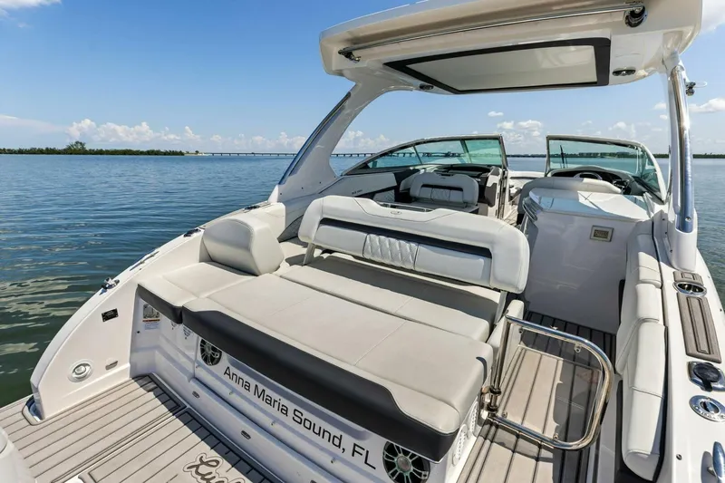  Yacht Photos Pics 2022 Regal 33 OBX boat with luxurious seating on calm waters, Anna Maria Sound.