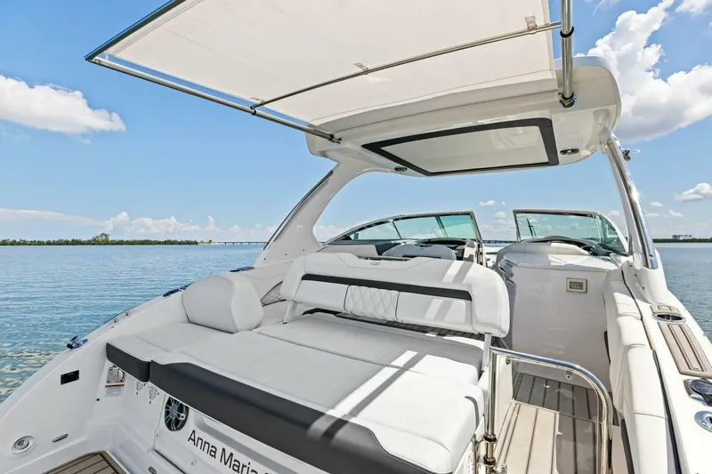  Yacht Photos Pics 2022 Regal 33 OBX boat interior with spacious seating and scenic water view.