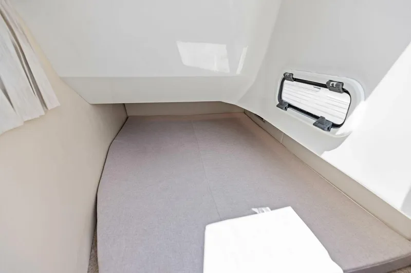  Yacht Photos Pics 2022 Regal 33 OBX cabin interior with bed and window.