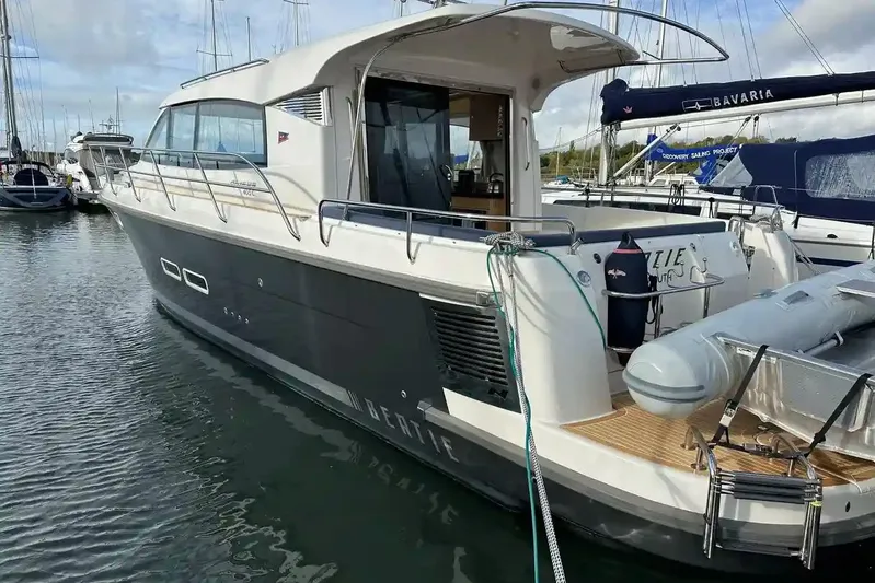 Bertie Yacht Photos Pics 2024 Nimbus 405 Coupé yacht docked at a marina, showcasing sleek design and modern features.