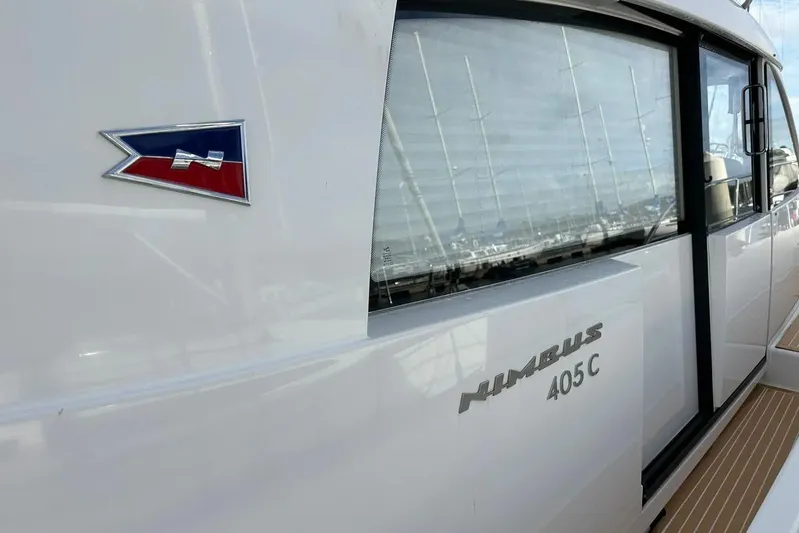 Bertie Yacht Photos Pics 2024 Nimbus 405 Coupé yacht side view with logo and window detail.