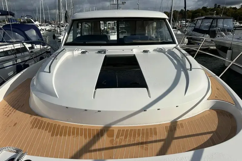 Bertie Yacht Photos Pics 2024 Nimbus 405 Coupé yacht docked at marina, showcasing sleek design and spacious deck.