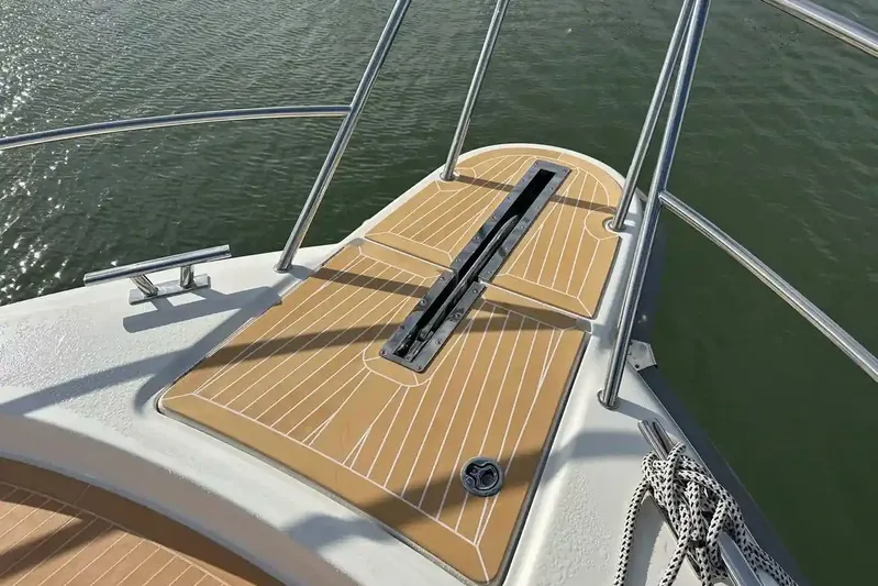 Bertie Yacht Photos Pics Bow deck of 2024 Nimbus 405 Coupé yacht with teak flooring and stainless steel railings.
