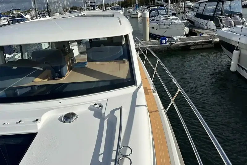 Bertie Yacht Photos Pics 2024 Nimbus 405 Coupé yacht docked at marina, showcasing sleek design and spacious deck.