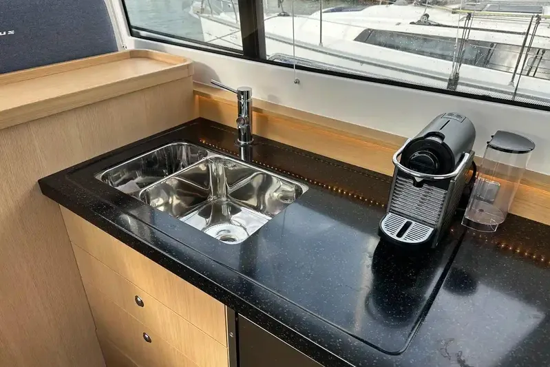 Bertie Yacht Photos Pics Modern kitchen area in 2024 Nimbus 405 Coupé yacht with sink and coffee machine.