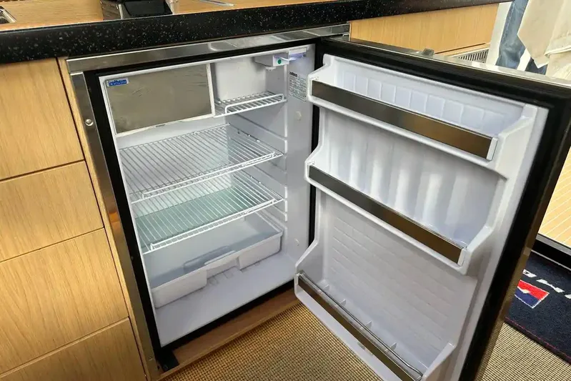 Bertie Yacht Photos Pics Open refrigerator in 2024 Nimbus 405 Coupé yacht kitchen interior.