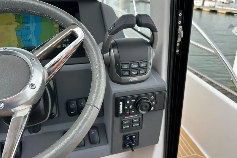 Bertie Yacht Photos Pics Steering wheel and controls of 2024 Nimbus 405 Coupé boat cockpit.