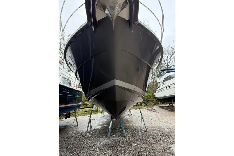 Bertie Yacht Photos Pics 2024 Nimbus 405 Coup&eacute; boat on stands, front view, outdoors.