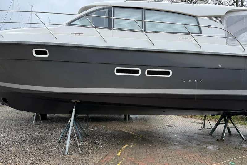 Bertie Yacht Photos Pics 2024 Nimbus 405 Coup&eacute; yacht on stands, side view, showcasing sleek design.