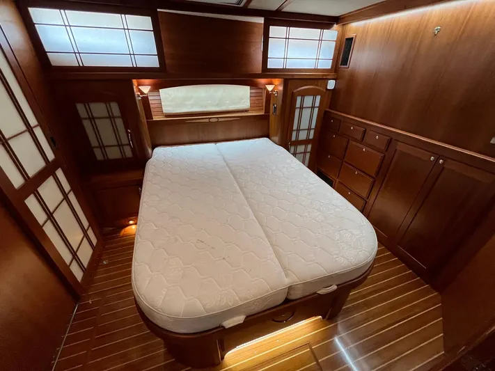  Yacht Photos Pics Luxurious 2013 Sabre 48 Salon Express cabin with elegant wood finish and comfortable bed.