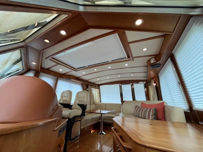  Yacht Photos Pics Interior of 2013 Sabre 48 Salon Express yacht with luxurious seating and wood finishes.