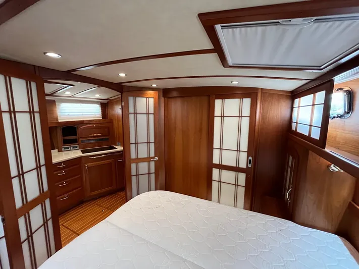  Yacht Photos Pics Luxurious interior of 2013 Sabre 48 Salon Express yacht with wood paneling and modern amenities.