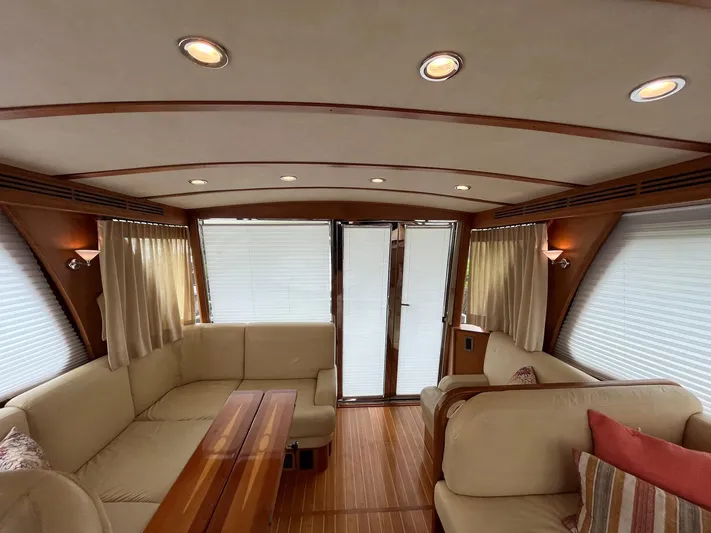  Yacht Photos Pics Interior of 2013 Sabre 48 Salon Express yacht with elegant seating and wood accents.