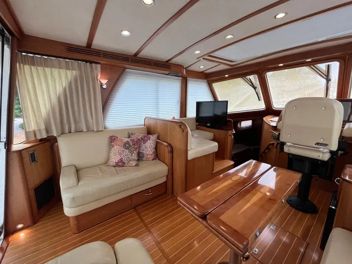 Yacht Photos Pics Luxurious interior of 2013 Sabre 48 Salon Express yacht with elegant wood finishes.