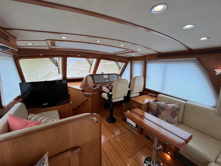  Yacht Photos Pics Luxurious interior of 2013 Sabre 48 Salon Express yacht with wood finish and seating.