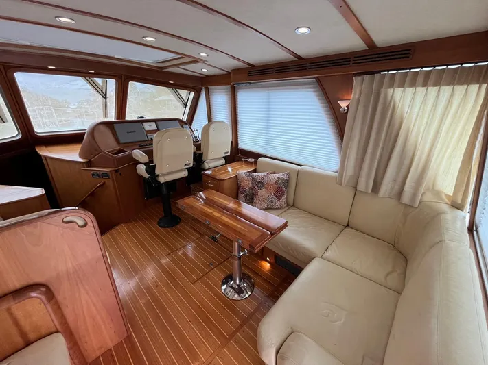  Yacht Photos Pics Interior of 2013 Sabre 48 Salon Express yacht with elegant seating and helm.