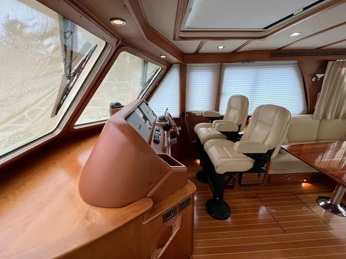  Yacht Photos Pics Interior of 2013 Sabre 48 Salon Express yacht with leather seats and wooden finishes.