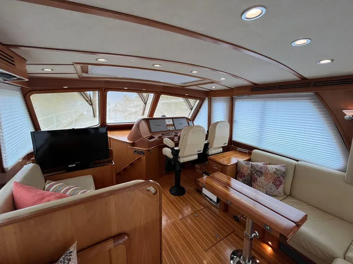  Yacht Photos Pics Interior of 2013 Sabre 48 Salon Express yacht with elegant wood finish and modern seating.