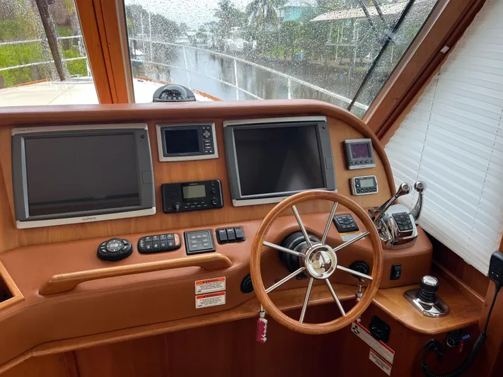  Yacht Photos Pics 2013 Sabre 48 Salon Express helm with dual screens and wooden steering wheel.