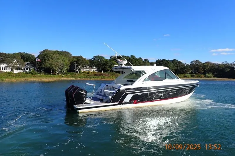  Yacht Photos Pics 2022 Formula 380 Super Sport Crossover OB cruising on a sunny day.