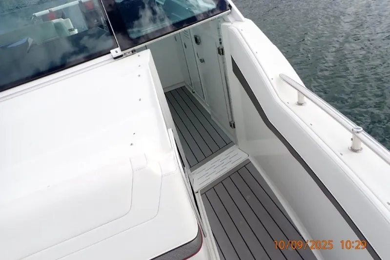  Yacht Photos Pics 2022 Formula 380 Super Sport Crossover OB boat deck, sleek design, near water.
