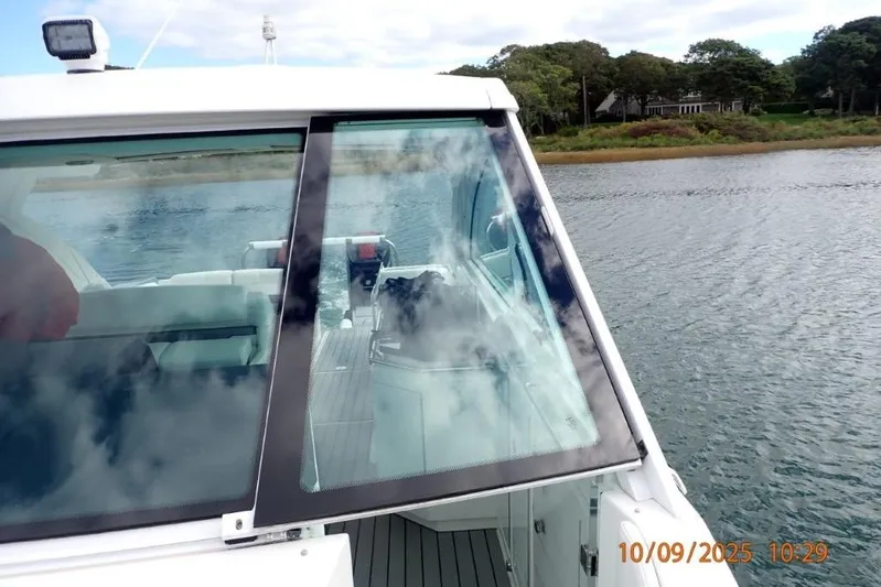  Yacht Photos Pics 2022 Formula 380 Super Sport Crossover OB on calm water, showcasing sleek design.