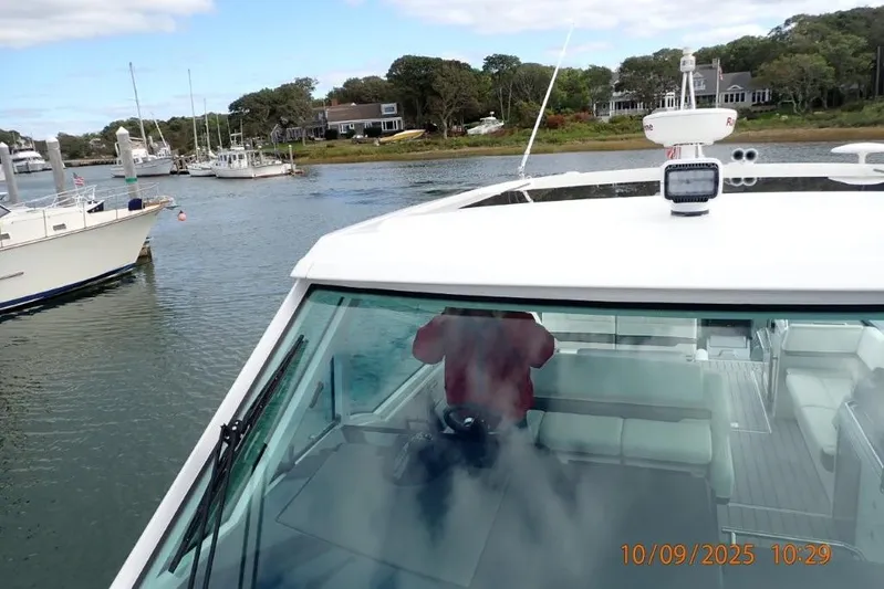  Yacht Photos Pics 2022 Formula 380 Super Sport Crossover OB on a scenic waterway with nearby boats.