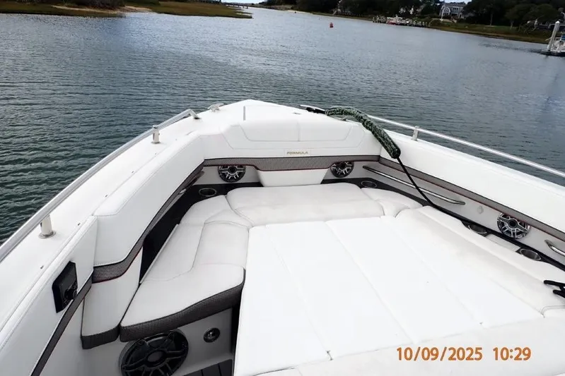 Yacht Photos Pics 2022 Formula 380 Super Sport Crossover OB boat interior with white seating on calm water.