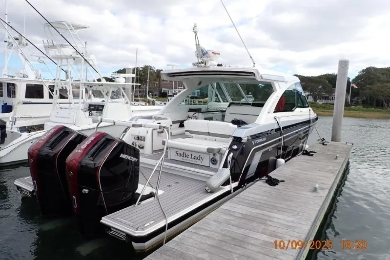  Yacht Photos Pics 2022 Formula 380 Super Sport Crossover OB docked with twin Mercury outboards.