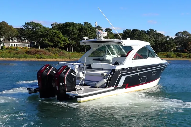  Yacht Photos Pics 2022 Formula 380 Super Sport Crossover OB cruising on a scenic waterway.