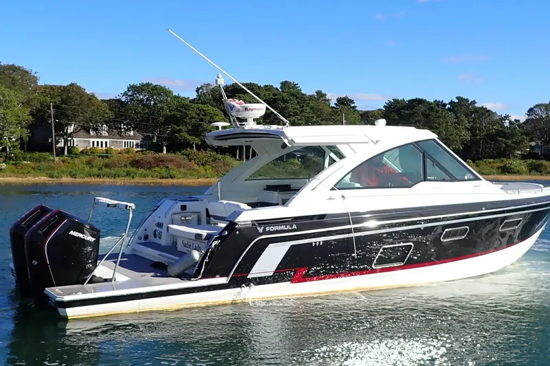  Yacht Photos Pics 2022 Formula 380 Super Sport Crossover OB cruising on a serene lake.